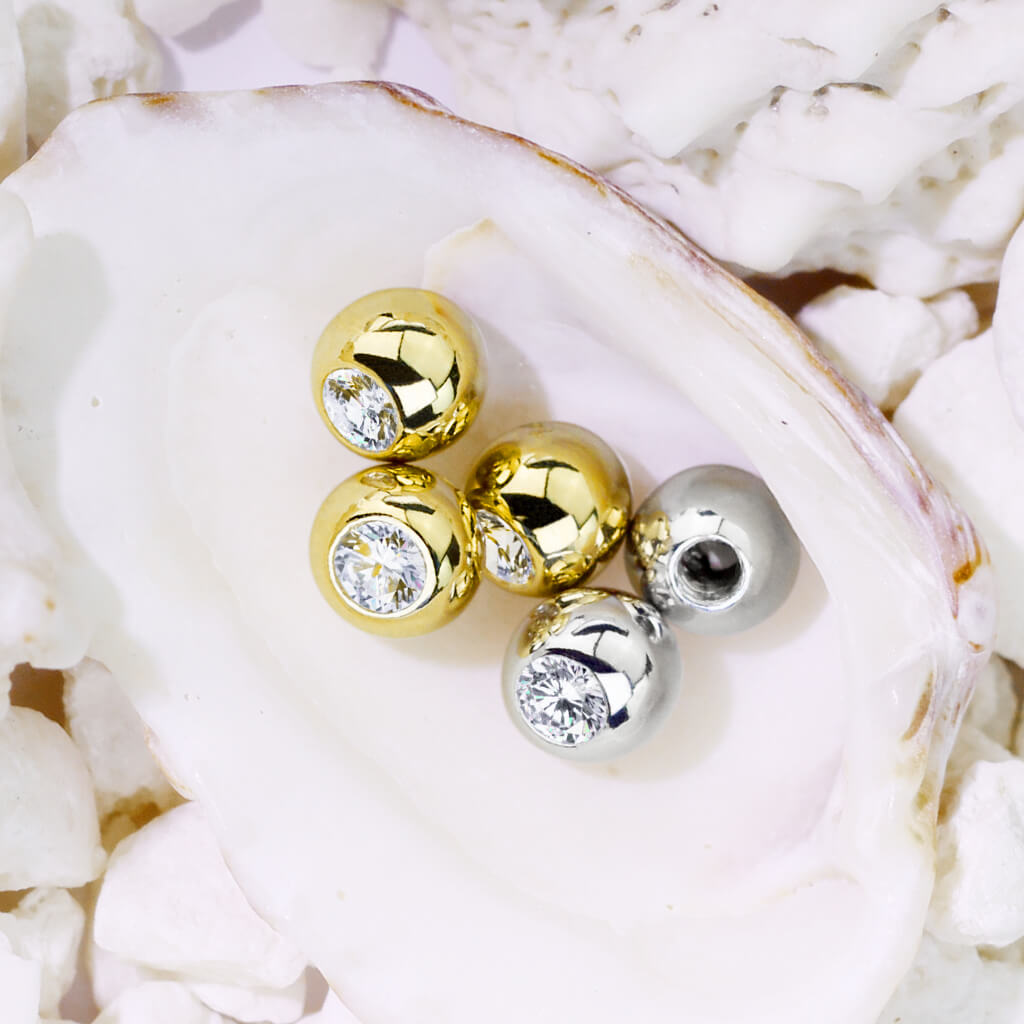 Solid Gold 14 Carat top ball with zirconia